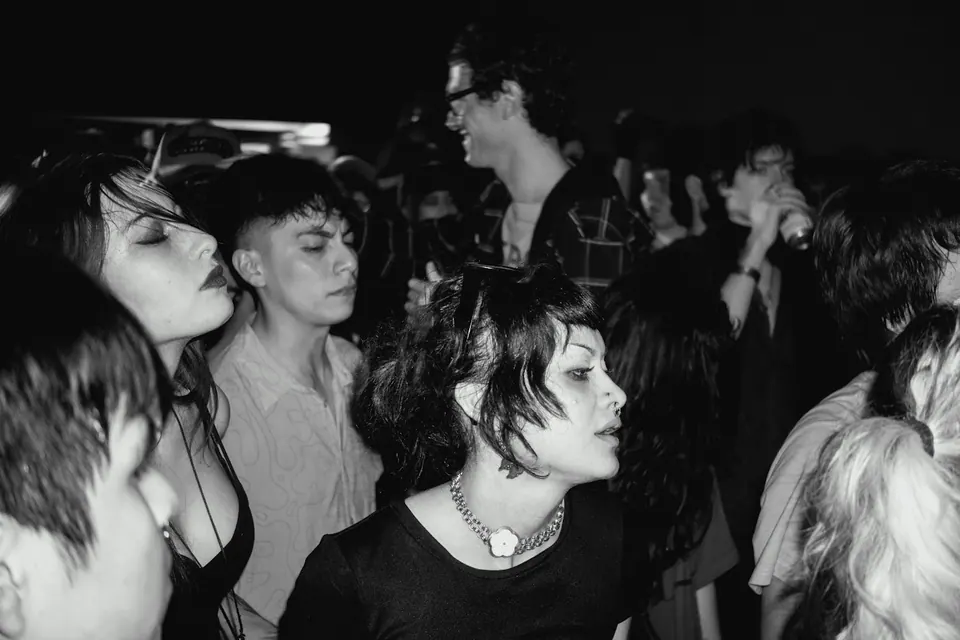 People enjoying a live music event — illustrative Unsplash service cover